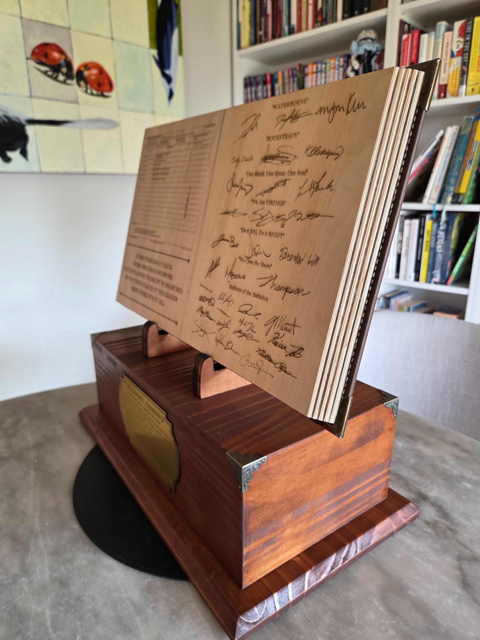 Original photograph of handcrafted engraved open-book military trophy