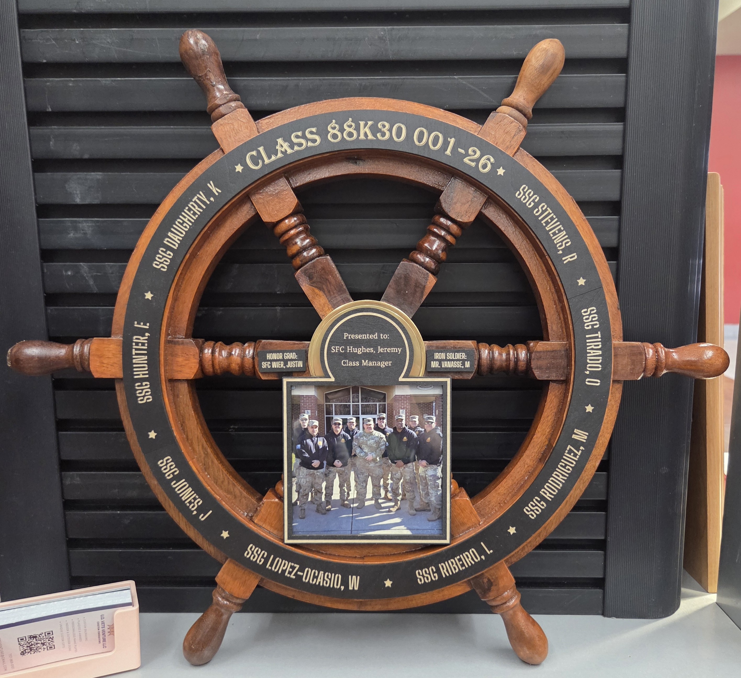 Class 88K30 ship wheel award with group photo